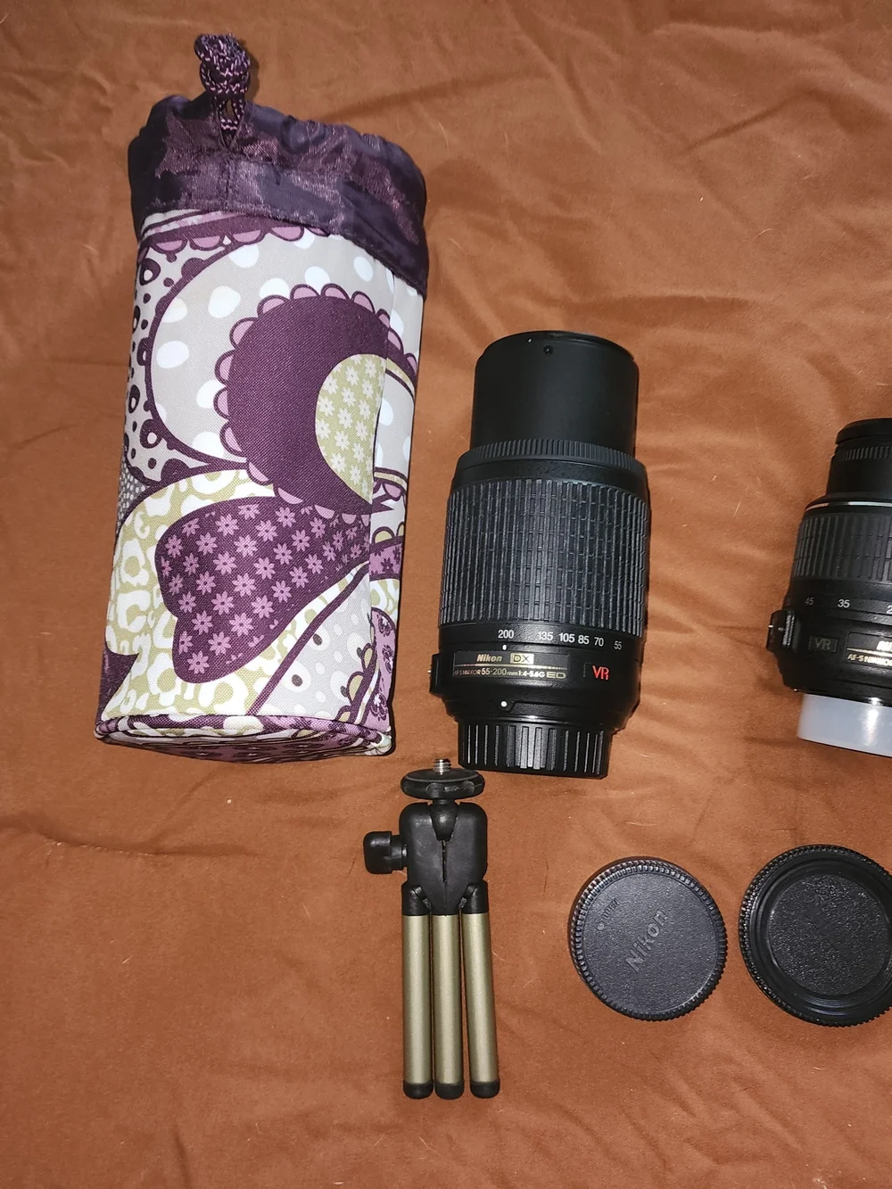 Nikon black DSLR Camera Body with Two Black Zoom Lenses